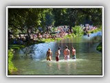 Taking a frersh dive in the Eisbach at the English Garten. © Biserko | Dreamstime.com