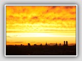 Sunset over Munich, with the silhouettes of the Marienkirche and BMW Tower. © Intrepix | Dreamstime.com